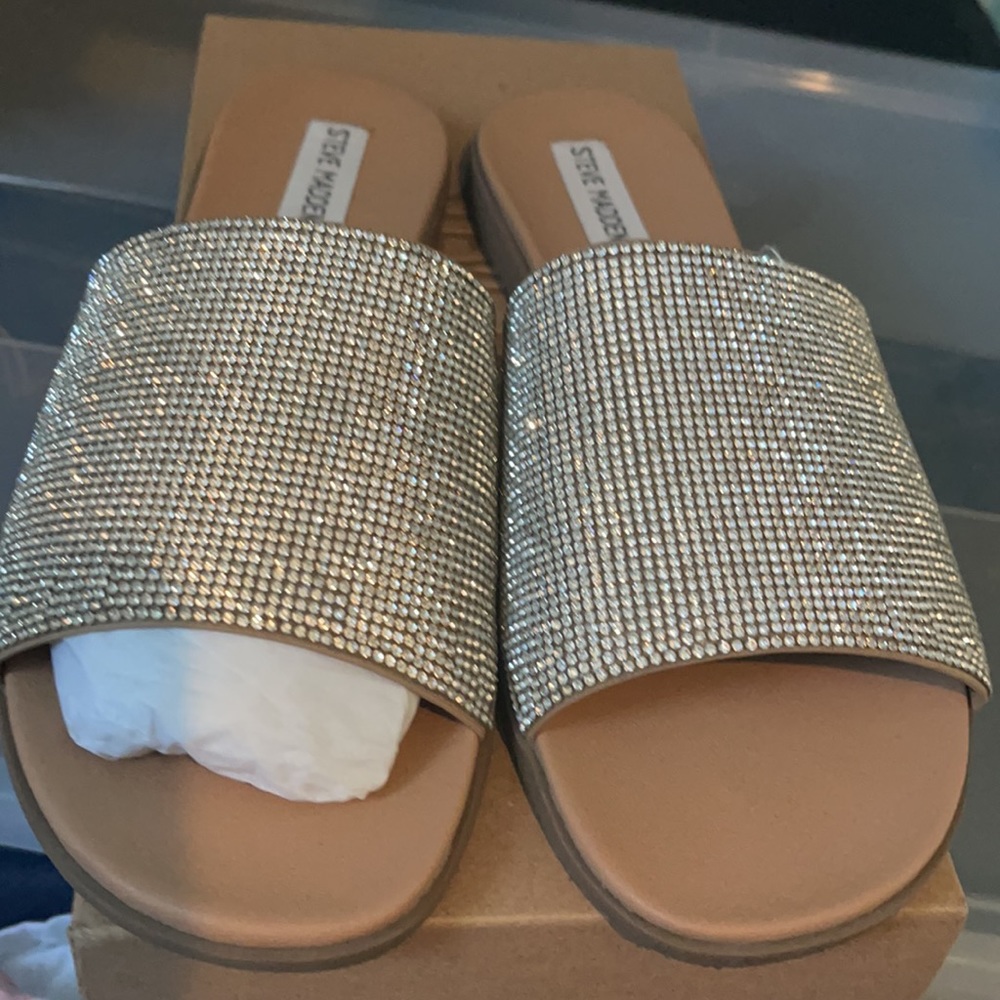 Beautiful bling bling sandals worn once. Size 10 in women.